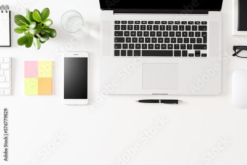 Modern office desktop with laptop and accessories