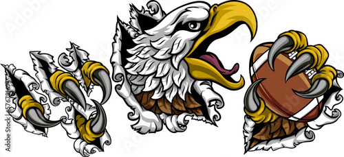 A bald eagle or hawk with claw talons holding an American football ball and ripping or tearing through the background. Sports Mascot