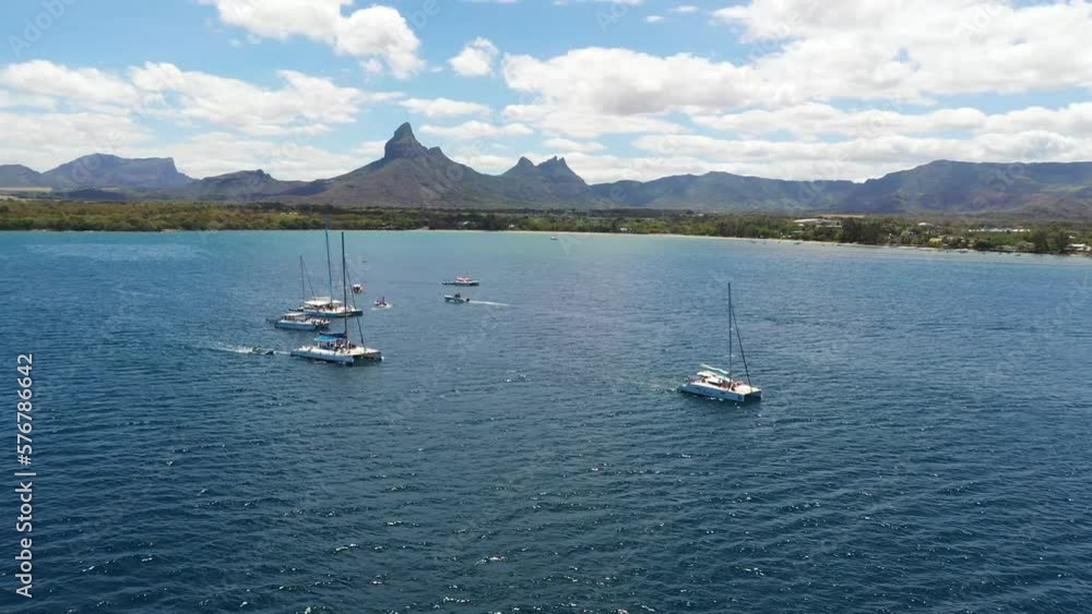 Aerial view of sailing boats along the coastline in Flic en Flac on Mauritius Island. Aerial view of sailing boats along the coastline in Flic en Flac on Mauritius Island.