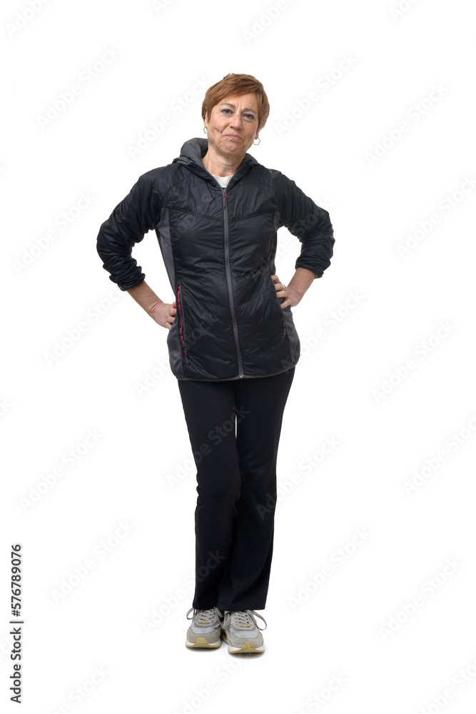 front view of a woman with sportswear witn arms akimbo o white background front view of a woman with sportswear witn arms akimbo o white background