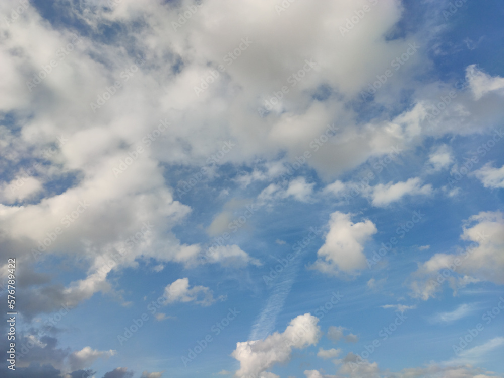 Multi-shaped and abstract clouds in the blue sky Multi-shaped and abstract clouds in the blue sky
