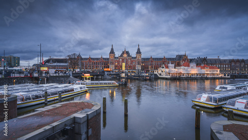 Amsterdam Centraal and canal landscape at dusk