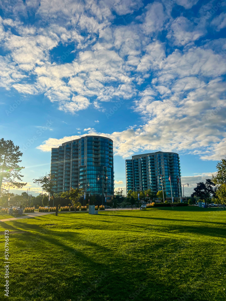 Luxury waterfront condominiums on a bright sunny day in autumn with sun setting behind
