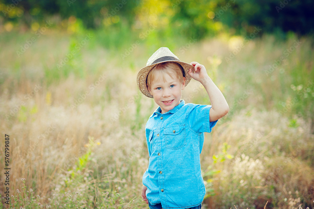 Little boy enjoying life and nature. Happy Kid on summer field . Fresh air, environment concept. Little boy enjoying life and nature. Happy Kid on summer field . Fresh air, environment concept.