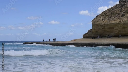 Beautiful beach view of agebah and rock cliffs in marsa matrouh Egypt on sunny day photo