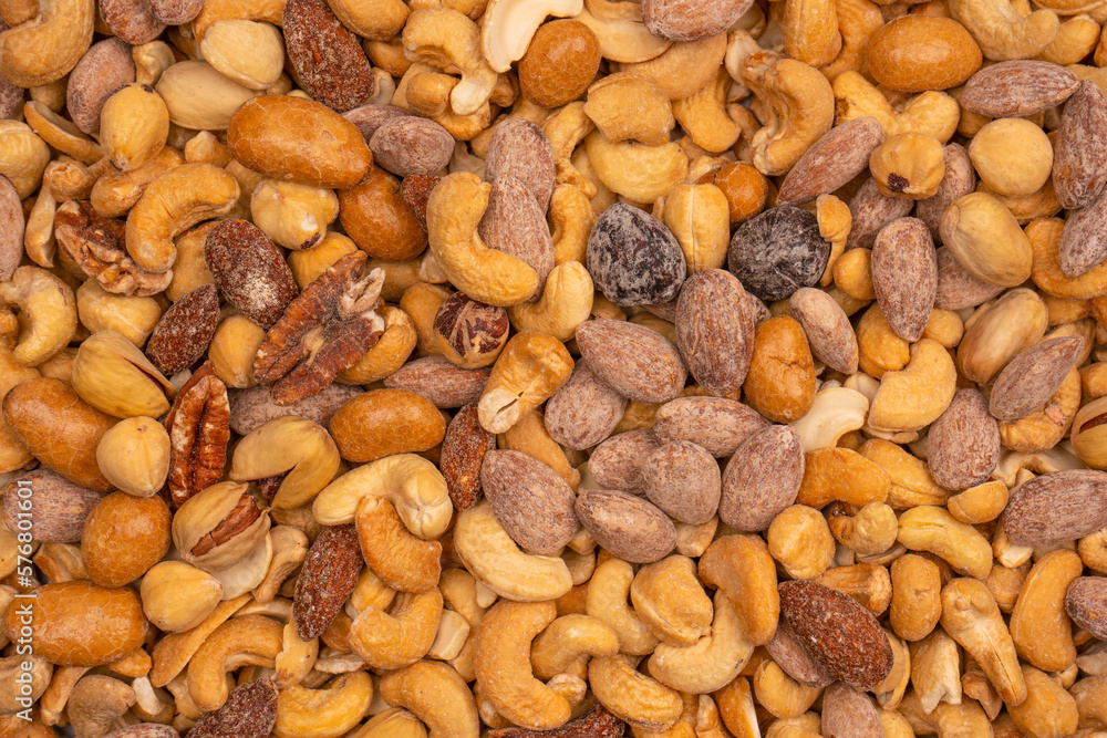 A group of almonds, pistachios, walnuts, macadamia, cashews. A group of almonds, pistachios, walnuts, macadamia, cashews.