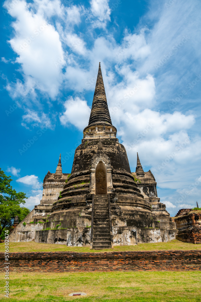 Ruins of ancient city and temples Ayutthaya, Thailand. Old kingdom of Siam. Summer day with blue sky. Famous tourist destination, spiritual place near Bangkok.