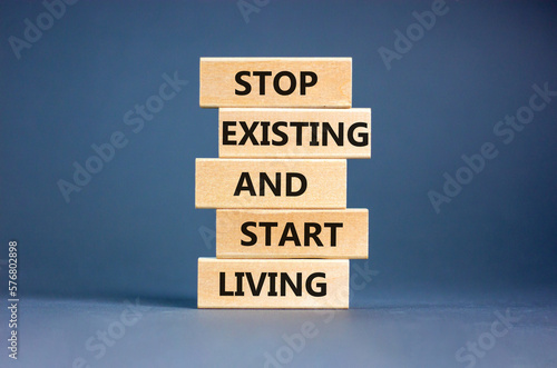 Фотография Stop existing start living symbol