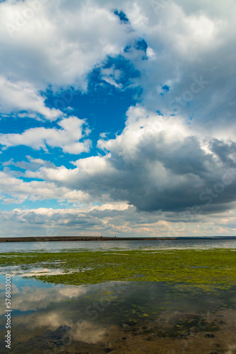 Reflection of white storm clouds in the water of the Tiligul estuary  Ukraine