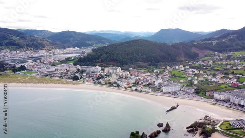 Aerial perspective of beautiful landscaped of Galicia. View of Covas city, a costal city situated in northwest of Spain.  Village at the base of the mountain. Typically Galician landscape. Backwards photo