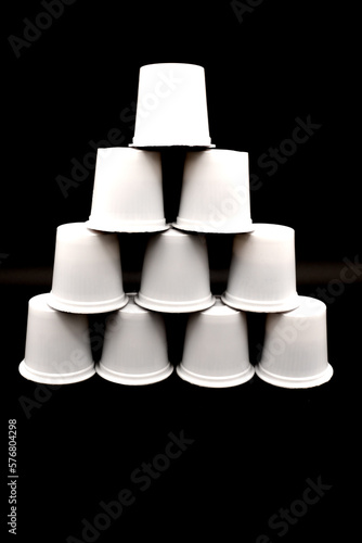 Coffee k-cups stacked in a pyramid shape.