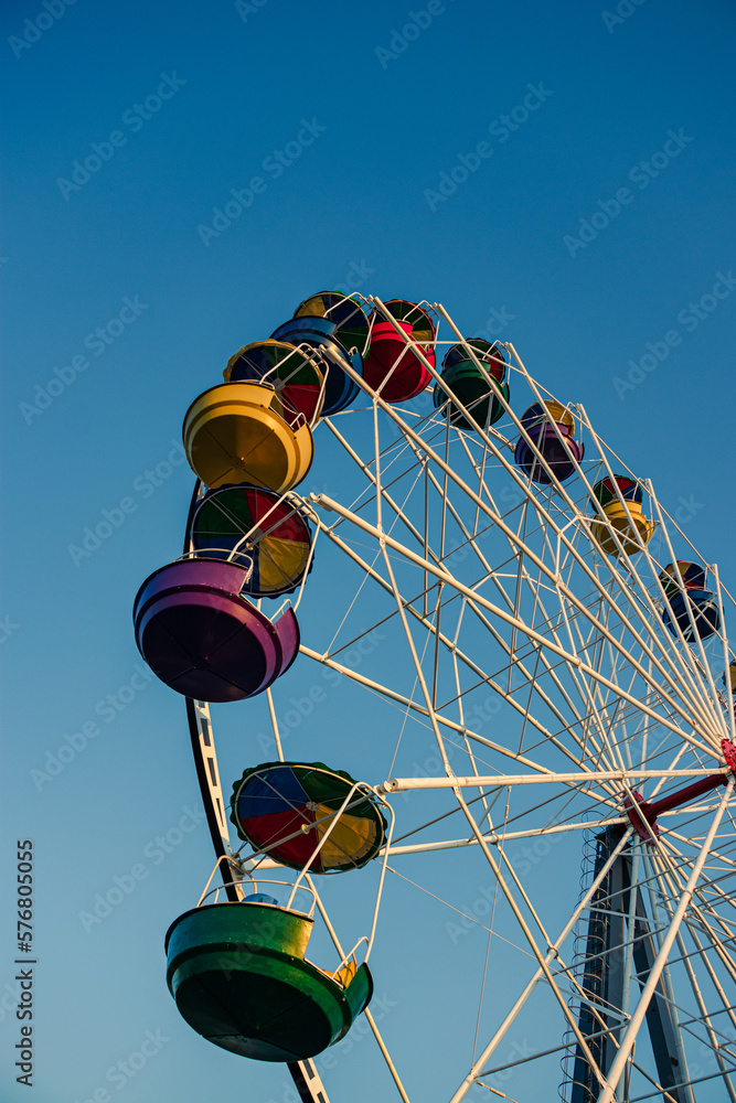 Ferris wheel on a blue sky