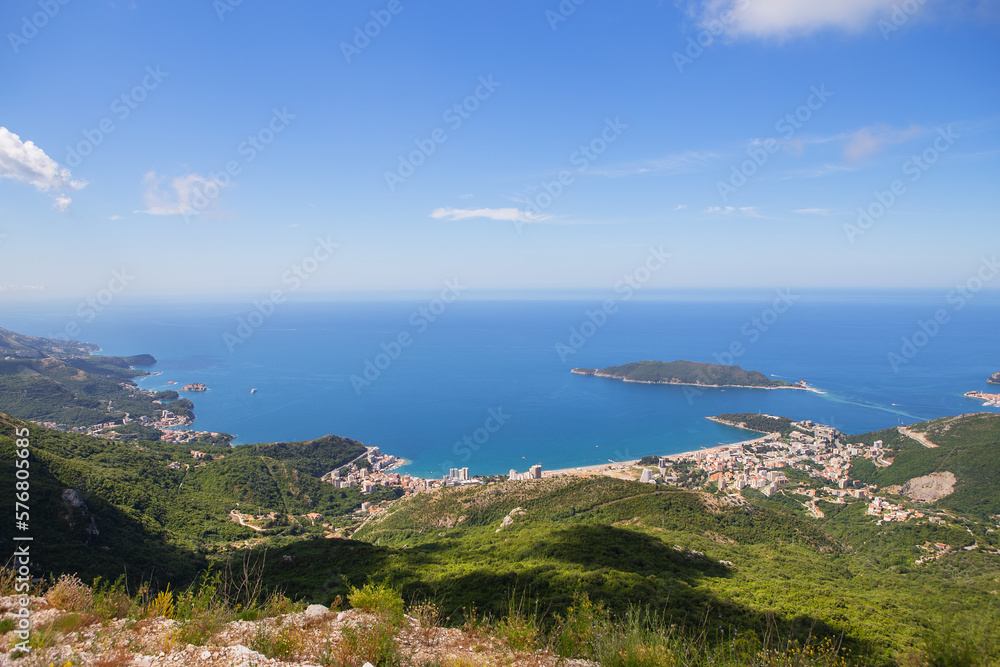 View of the city from the top of the mountain road. View of the coast and the city of Budva Riviera. Montenegro, Balkans, Adriatic Sea, Europe.