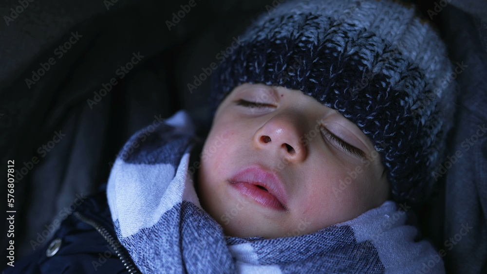 Closeup child face napping during winter season. Warm little boy asleep Closeup child face napping during winter season. Warm little boy asleep