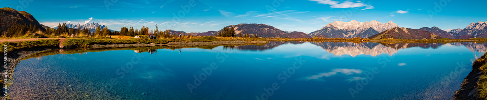 High resolution stitched autumn panorama with reflections in a lake at the famous Streuboeden summit, Fieberbrunn, Tyrol, Austria