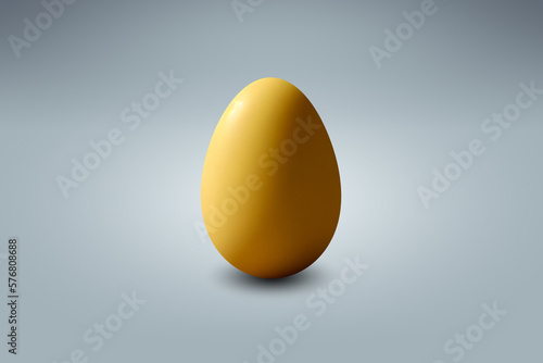 Yellow easter egg on a light blue floor