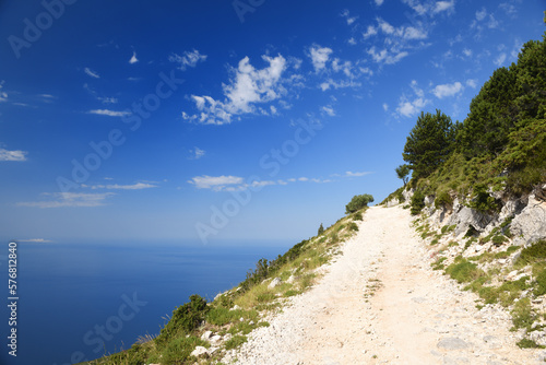 Road overlooking the mediterranean sea on a bright sunny day. Mountains of Albania overlooking the Ionian Sea from.