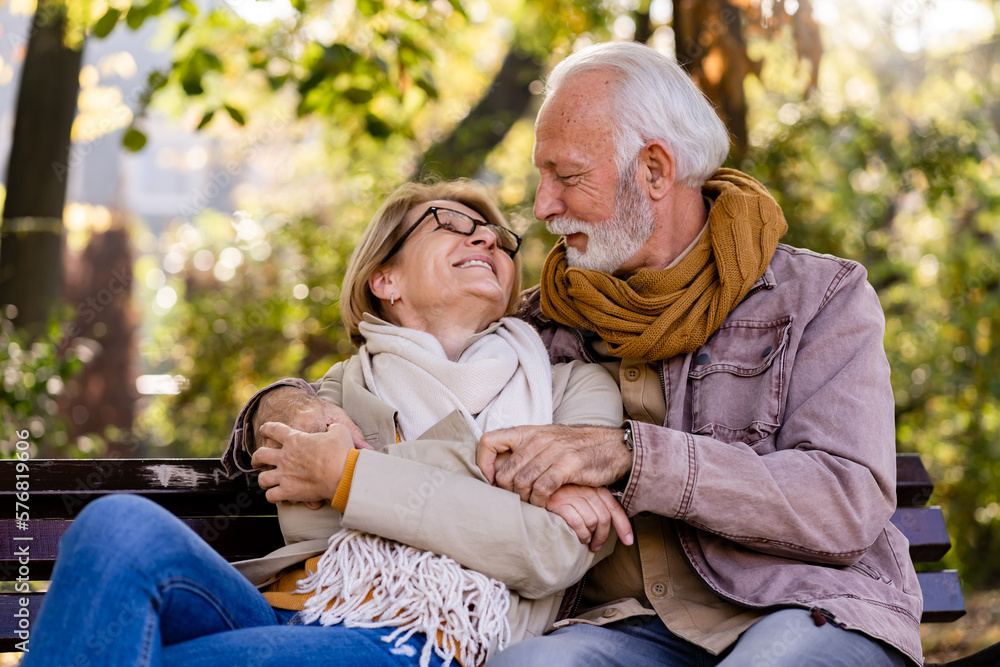 Portrait of a beautiful senior couple in the public park. Early retirement Portrait of a beautiful senior couple in the public park. Early retirement