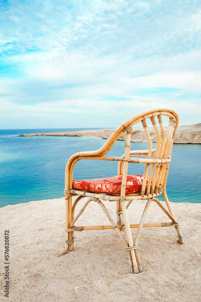 Stylishly beautiful chair on the sea nature landscape background
