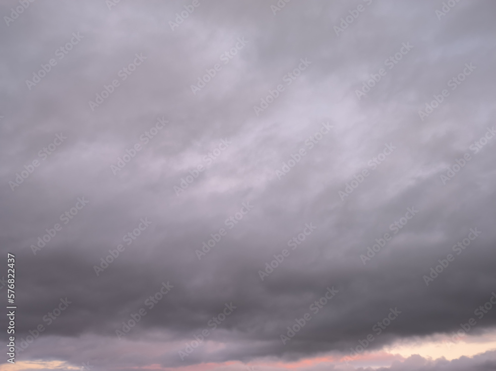 Compact cloud enomre gray covering the pink dusk