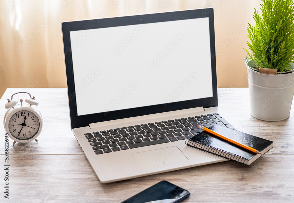 Fototapeta premium Desk Laptop With Blank Screen On Table