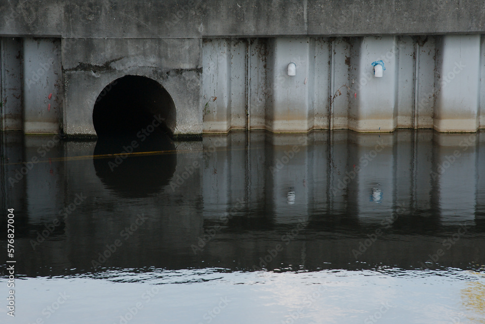 Culvert Opening in Pond Daylight Water Reflection