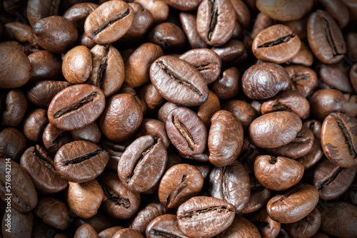 Close-up of roasted coffee beans, background, texture. Good mood. Coffee aroma