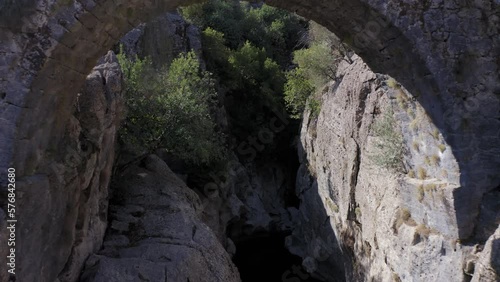 Ancient Roman bridge over the mountain river running through the Koprulu Canyon in Turkey photo