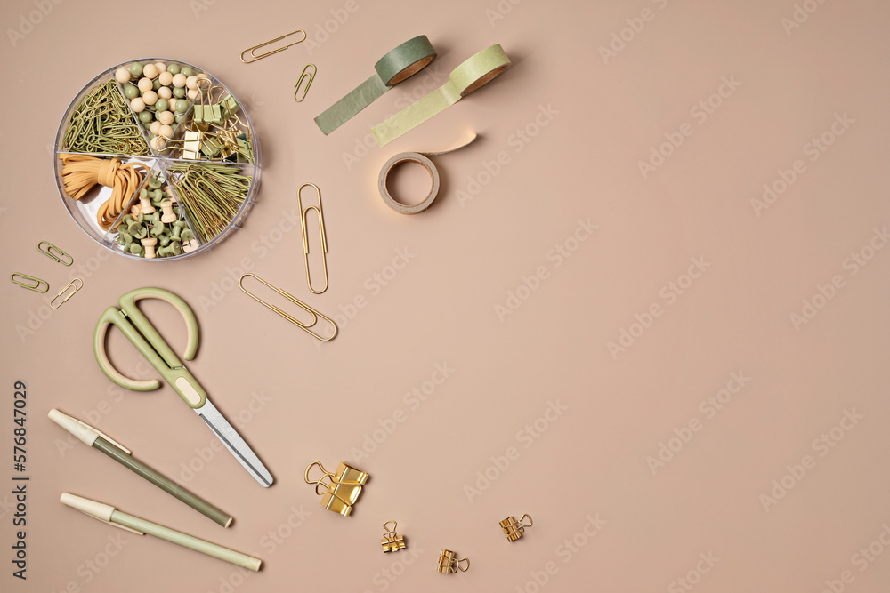 Flatlay of office supplies made of recycled materials on beige background with copy space for text. Banner, flat lay, top view Flatlay of office supplies made of recycled materials on beige background with copy space for text. Banner, flat lay, top view