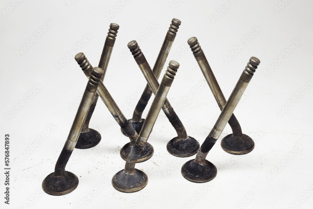 poppet valves of reciprocating engine of sixteen valve motor car, bent