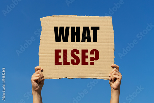 What else text on box paper held by 2 hands with isolated blue sky background. This message board can be used as business concept to ask anyone 