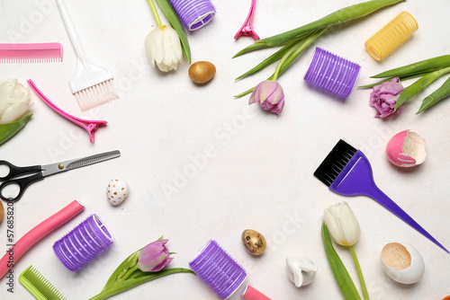 Canvas Print Frame made of hairdresser's tools, Easter eggs and tulips on white background