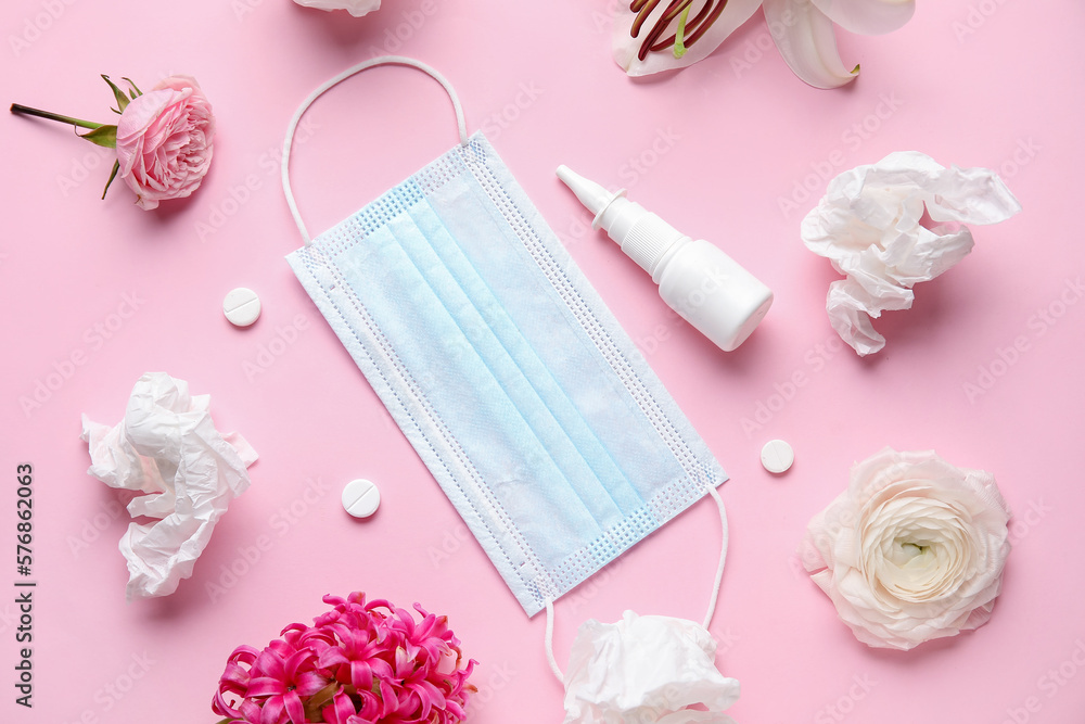 Nasal drops with pills, flowers, medical mask and tissues on pink background. Seasonal allergy concept Nasal drops with pills, flowers, medical mask and tissues on pink background. Seasonal allergy concept