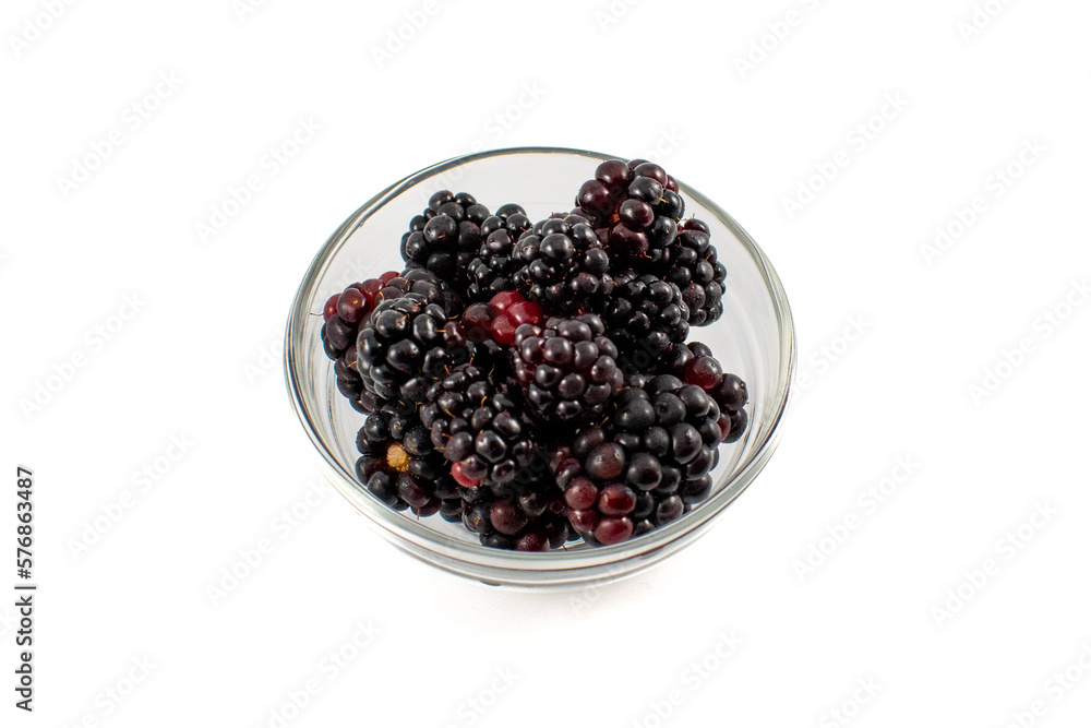 Glass prep bowl full of ripe juicy blackberries Glass prep bowl full of ripe juicy blackberries