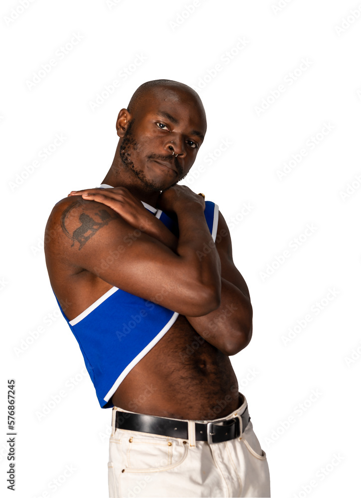 Athletic black gay man posing standing with shirt off.