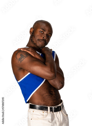 Athletic black gay man posing standing with shirt off.