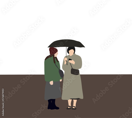 Two woman with phone standing under umbrella while waiting cars on the street. Raining day.