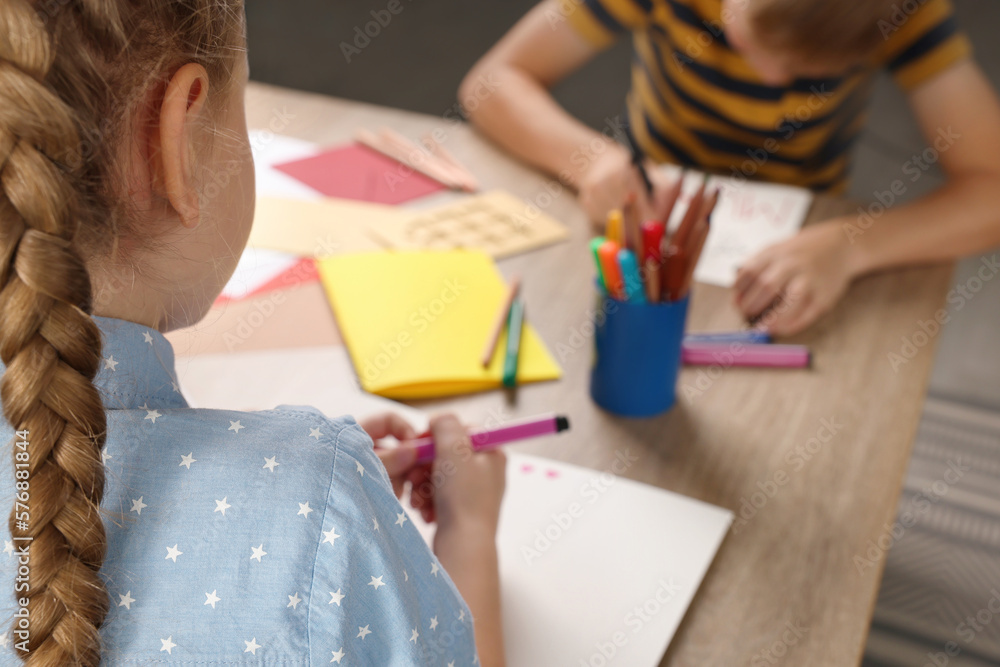 Children making beautiful greeting cards at table indoors, closeup Children making beautiful greeting cards at table indoors, closeup