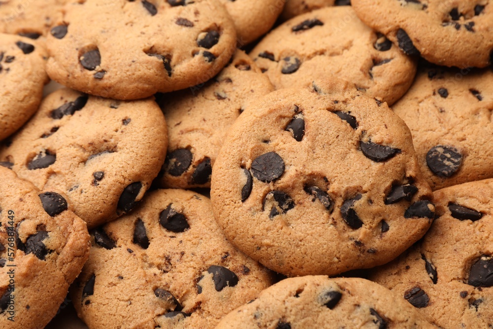 Delicious chocolate chip cookies as background, closeup Delicious chocolate chip cookies as background, closeup