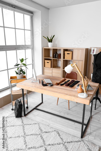 Tailor's workplace with com...