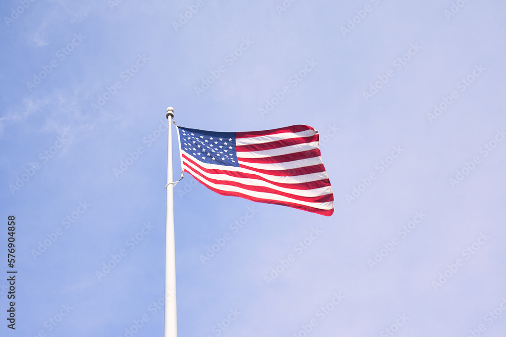 Fototapeta premium Proudly Waving: The American Flag Symbolizes Unity, Freedom, and Patriotism