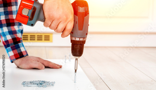 Wallpaper Mural a furniture assembler assembles furniture Torontodigital.ca