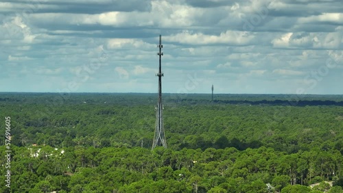 Aerial view of telecommunications cell phone tower with wireless communication 5g antennas for network signal transmission