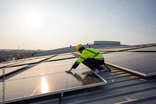 Fototapeta Professional engineer work to maintenance of photovoltaic panel system