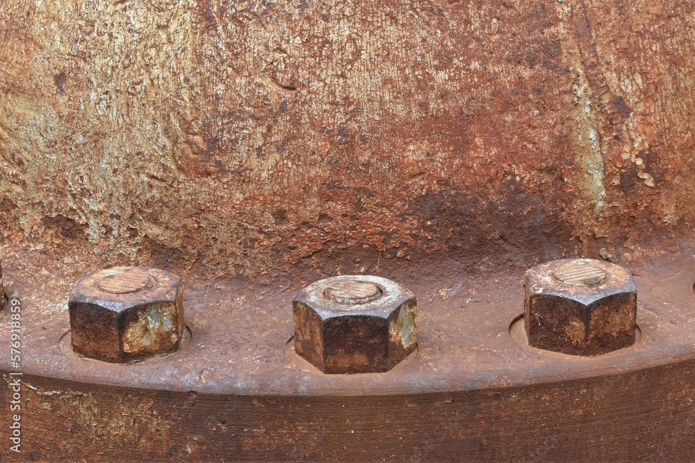 Close up of rusted bolts on an old electrical generating station. Close up of rusted bolts on an old electrical generating station.