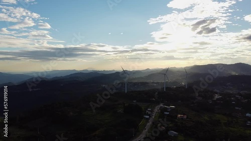 view of the mountains with windmills photo