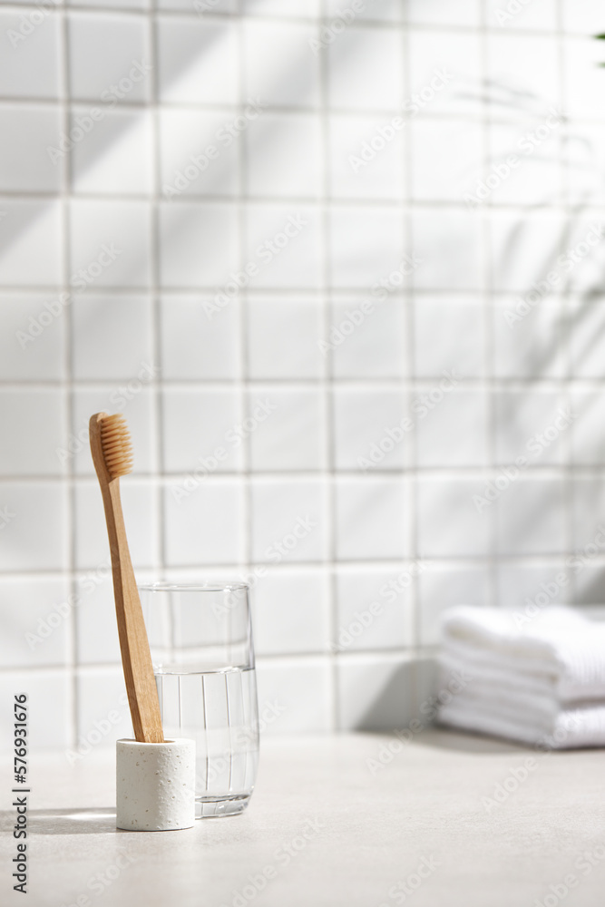 Various objects on a white tile background with warm sunlight shining through
Various objects on a white tile background with warm sunlight shining through