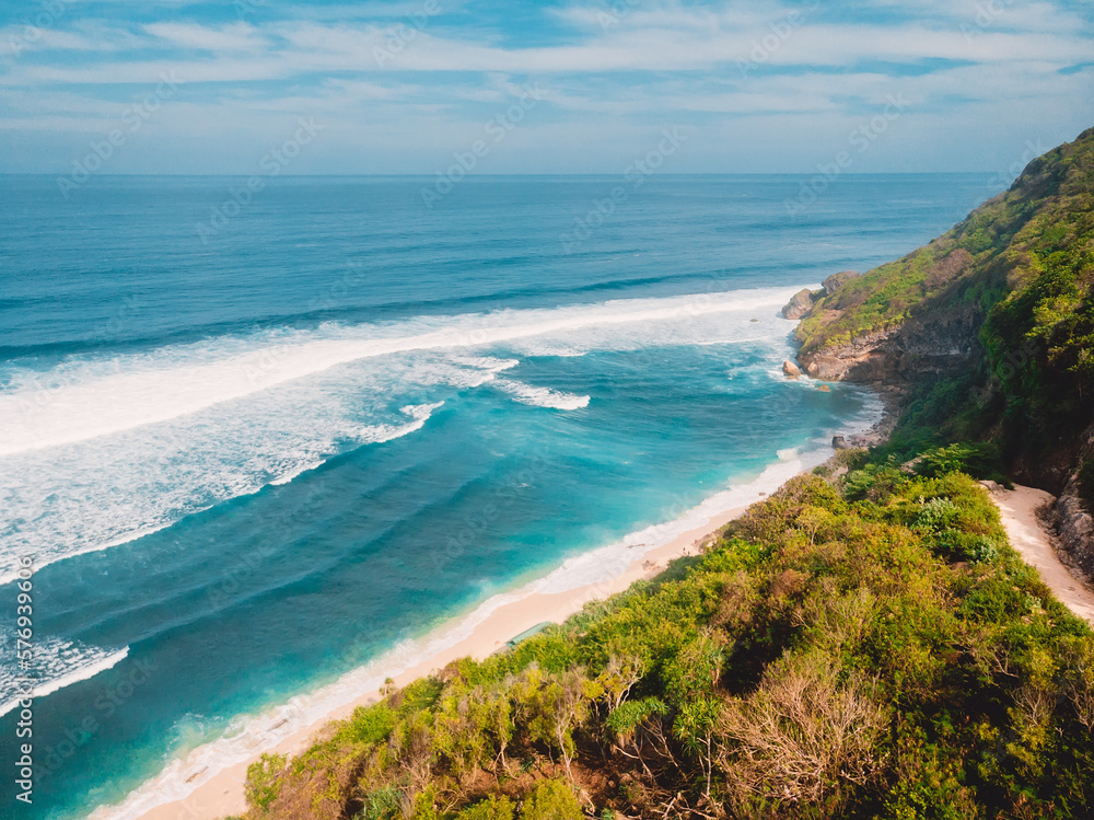 Amazing view of coastline with beach, mountains and blue ocean in Bali. Nyang Nyang beach. Amazing view of coastline with beach, mountains and blue ocean in Bali. Nyang Nyang beach.