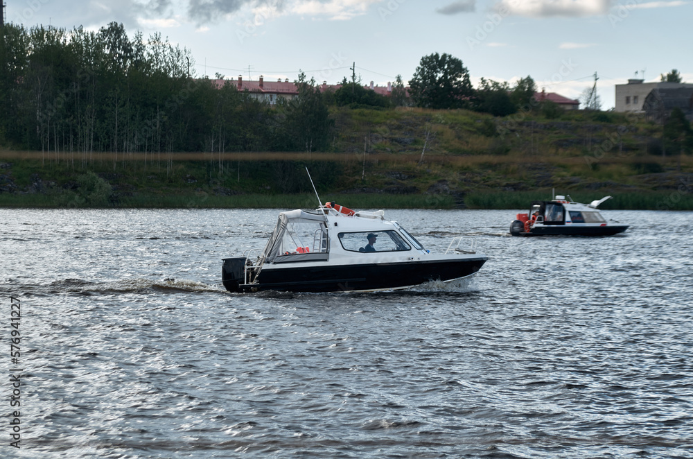 Dark speedboat goes on the water Dark speedboat goes on the water