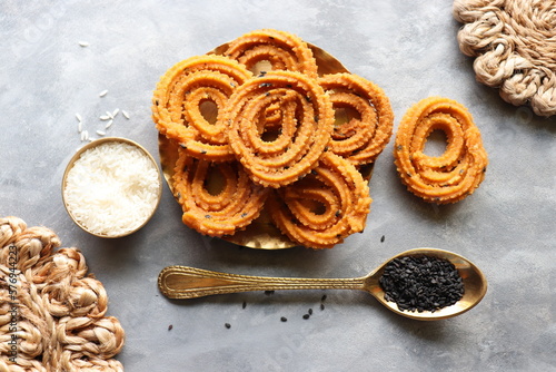 Butter murukku. also known as benne murukku or venna chakli. Chakli is a savory deep fried crispy snack made with rice and gram flour along with black sesame and spices. Copy space. photo